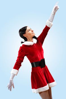 Santa Girl presenting your product, in costume and white gloves