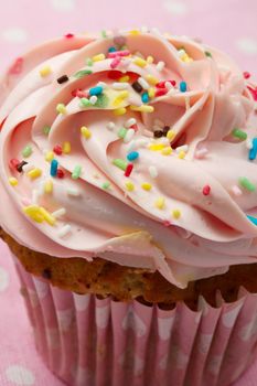 Delicious  cupcake with strawberry frosting