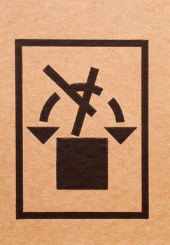 "Handle with care" sign on a cardboard box