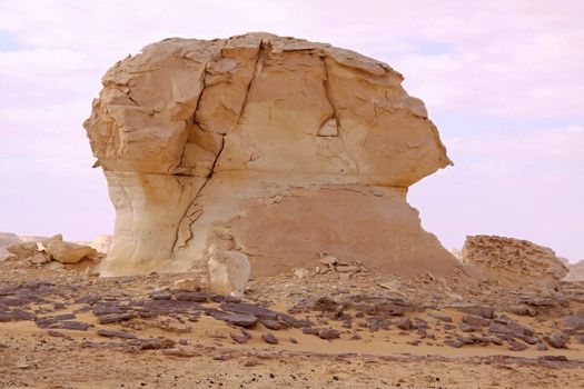 Wind and sand modeled rock sculptures in white desert