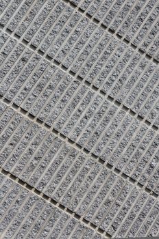 Corrugated concrete background showing Pattern of diagonal lines with shadow