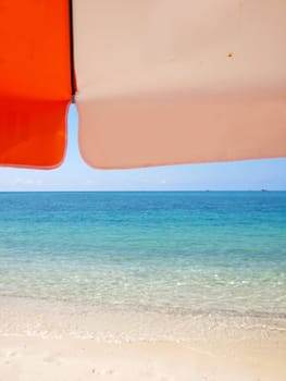 Sunshade on beach in island in sunny summer day