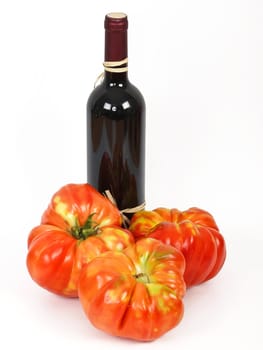classic breed of tomato with bottle of red wine