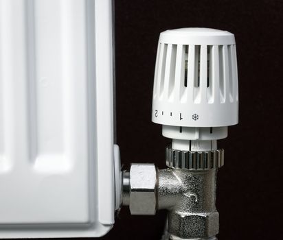 Thermostatic radiator valve set to minimal temperature close-up