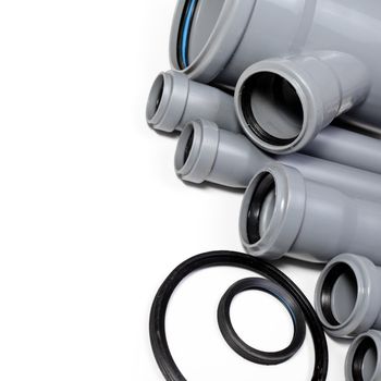 Grey PVC sewer pipes on white background