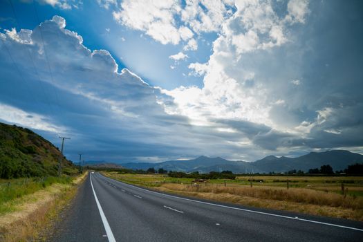 Country road with dramatic sky in the South Island of New Zealand
