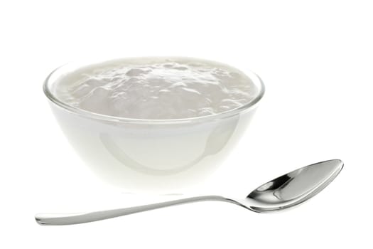 Yogurt bowl with spoon on white background