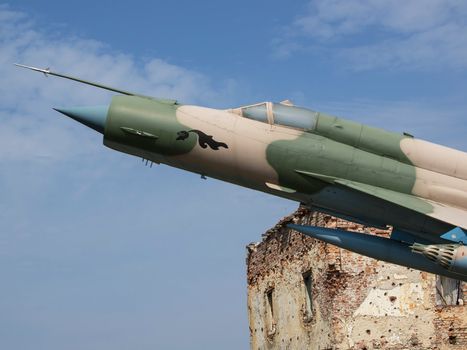 military plane and bombed ruins