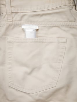 Pants pocket with chocolate or cereal bar in white wrapping
