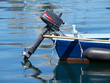 old wooden boat with outboard motor