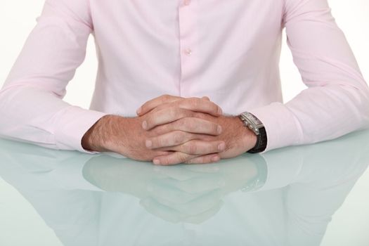 A cropped picture of a businessman's hands.