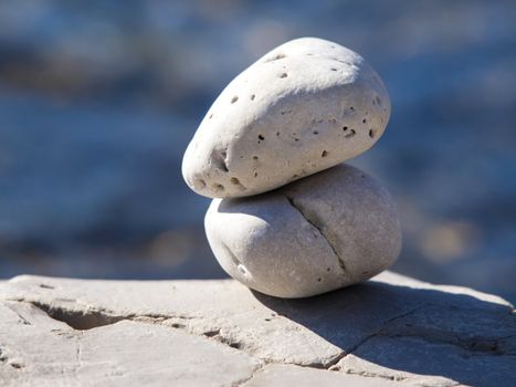 two stones on the rock near the sea