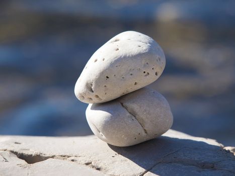 two stones on the blue sea