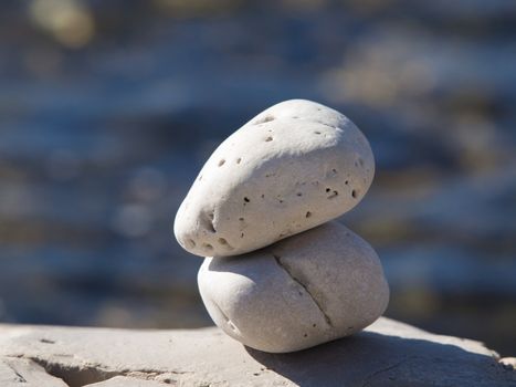 two stones near the blue sea