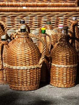 glass bottles protected with cane