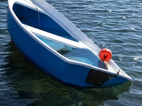 small plastic boat sinking after storm