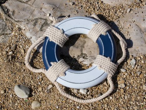blue and white safe belt on the beach