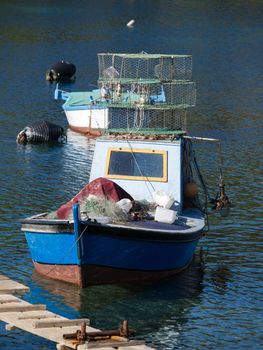 old fishing boat with nets,trap and lantern