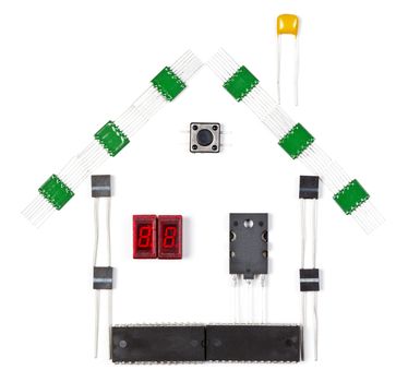 House made of electronic components on white background