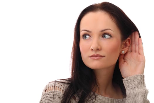 Beautiful and attractive girl listening gesture over a white background