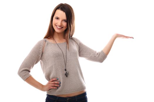 Beautiful girl posing with empty palm over a white background