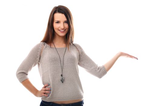 Beautiful girl posing with empty palm over a white background