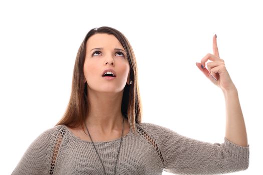 Pretty girl pointing at the sky isolated on a white background