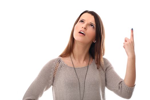 Pretty girl pointing at the sky isolated on a white background