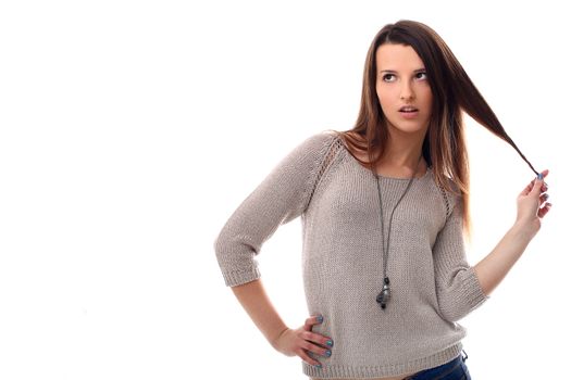 Beautiful brunette posing portrait over a white background