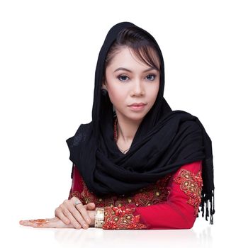 Beautiful muslim lady wear red with hijab, henna painted on hand