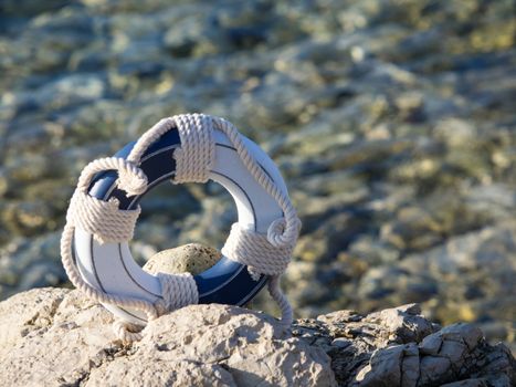 safe belt on the stone near the sea