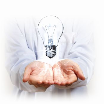 Hand with lamp and hands of a business person