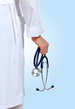 Portrait of happy successful young female doctor holding a stethoscope