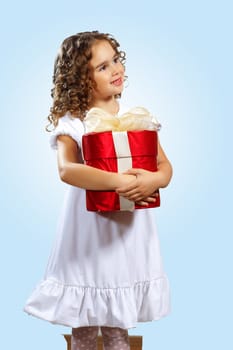 Portrait of an adorable preschool age girl wearing a Christmas holiday outfit