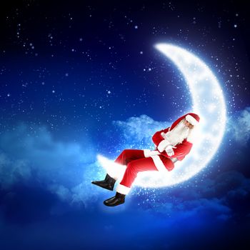 Photo of Santa Claus sitting on shiny moon above winter forest