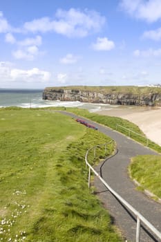 cliff walk with a beautiful view over the Ballybunion beach and cliffs on the Atlantic coast in Ireland
