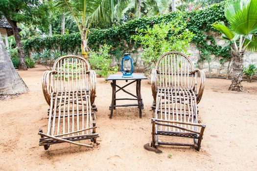 Kenya. Elegant furniture made of wood in an African garden