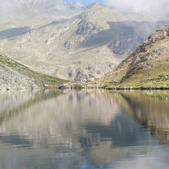 Alpine lake close to the path to the top of Monviso mountain, one of the most scenic mountain of Alps