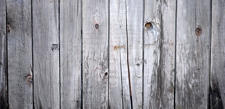 Close up of gray wooden fence panels 