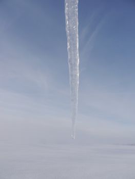 icicles hanging from the roof outside in landscape