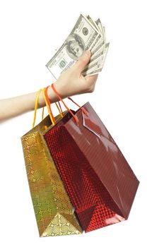 Hand with shopping bags and money