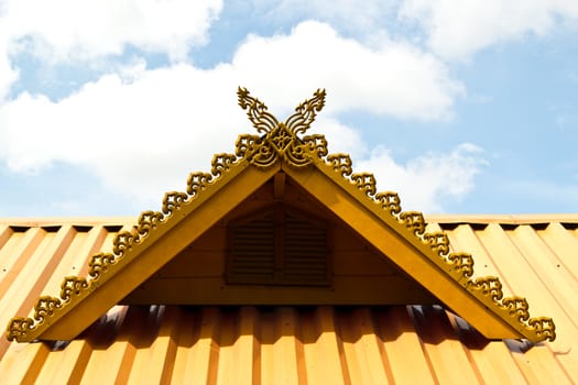 thai house roof an nice blue sky