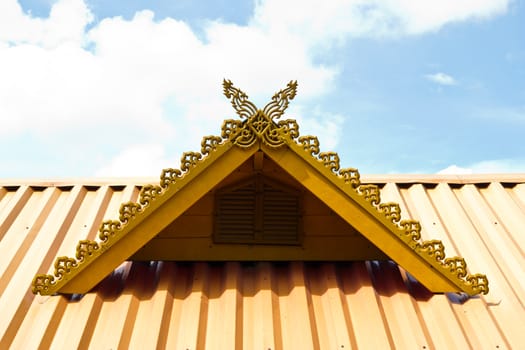 thai house roof an nice blue sky