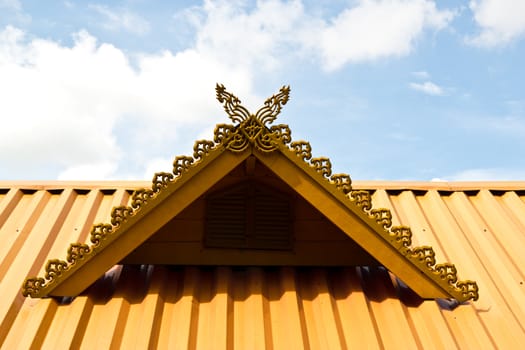 thai house roof an nice blue sky