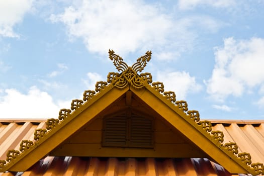 thai house roof an nice blue sky