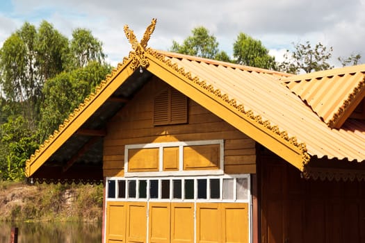 thai house roof an nice blue sky