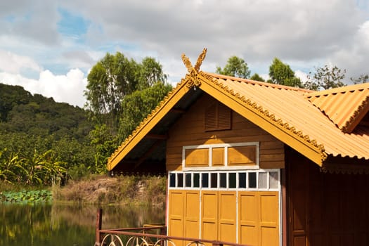 thai house roof an nice blue sky