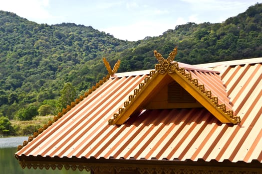 thai house roof an nice blue sky