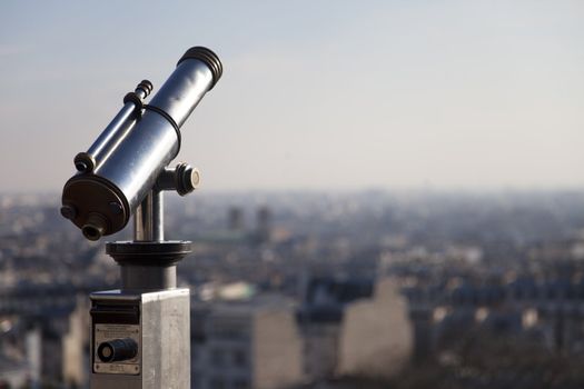 Telescope on top of Montmartre Paris with the city on the background