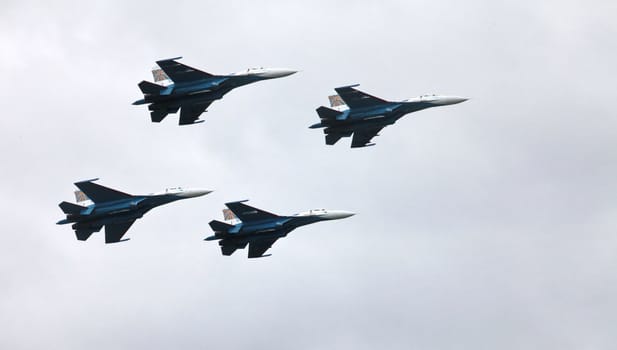 Aerobatic team "Russian Knights" on the Su-27 performs aerobatics demonstration